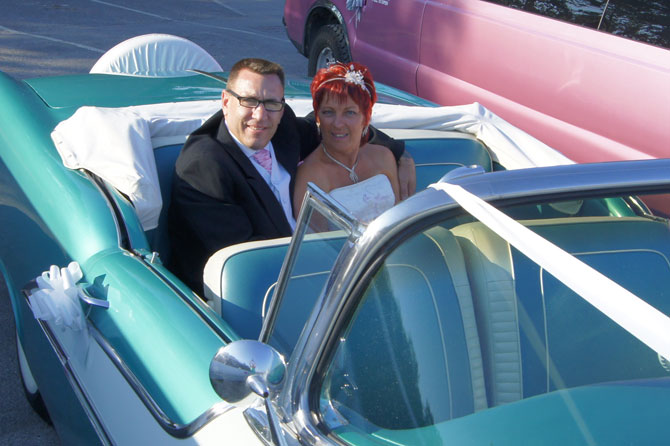 Blue Wedding Limo with couple in